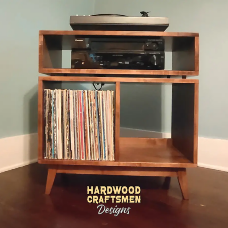Low-profile solid maple mid-century media console with a TV shelf, turntable compartment, equipment shelving, and two divided storage sections.