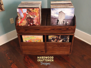 Dovetail 2 x 1.5 vinyl record storage features 2 pull out drawers below 2 flip bins in solid oak. This LP cabinet is available in solid walnut, ash, red oak, maple, cherry and oak, all on a 3 inch 100% hardwood plinth base.