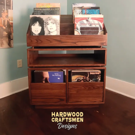 Dovetail 2 x 2.5 vinyl record shelves with equipment bay, 2 pull out storage drawers and 6 flip bins. This LP cabinet is available in solid walnut, ash, red oak, maple, cherry and oak, all on a 3 inch 100% hardwood plinth base.