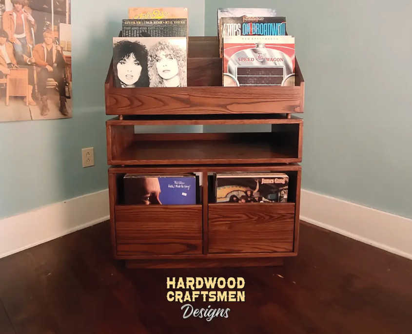 Dovetail 2 x 2.5 vinyl record shelves with equipment bay, 2 pull out storage drawers and 6 flip bins. This LP cabinet is available in solid walnut, ash, red oak, maple, cherry and oak, all on a 3 inch 100% hardwood plinth base.