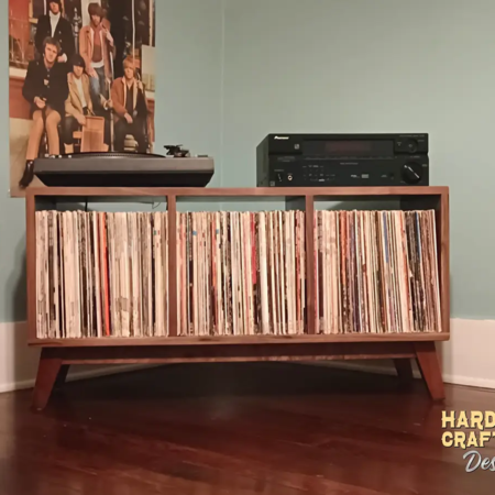 Low-profile solid walnut record console with turntable and media shelves, 3-bin storage, and tapered mid-century legs.