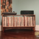 Low-profile solid walnut record console with turntable and media shelves, 3-bin storage, and tapered mid-century legs.