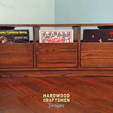 Solid hardwood dovetail 3 x 1 record storage cabinet with slide out drawers.