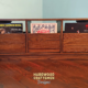 Solid hardwood dovetail 3 x 1 record storage cabinet with slide out drawers.