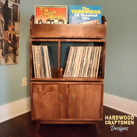 Solid maple record player stand with 2 doors & 2-to-4 LP flip bin compartments, available from 28-to-56-inches. This vinyl cabinet 3-tier features upper forward facing bins above 4-to-8 divided compartments, all on tapered mid-century legs.