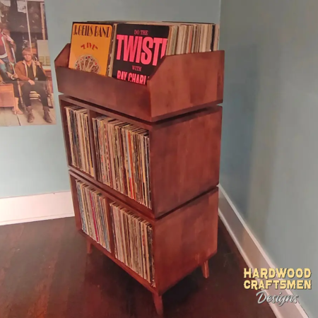 Solid maple record player stand featuring with dovetail drawers and 4-to-8 compartments below 2-to-6 LP flip bins. This vinyl cabinet 3-tier is available from 28-to-56-inches, all on tapered mid-century legs.