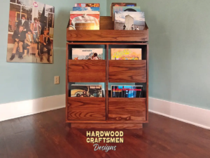 Dovetail 2 x 3 vinyl record shelves with 4 pull out storage drawers and 6 flip bins. This LP cabinet is available in solid walnut, ash, red oak, maple, cherry and oak, all on a 3 inch 100% hardwood plinth base.