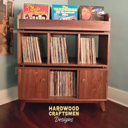 Solid walnut record storage cabinet with 2 doors & 3-to-5 LP flip bin compartments, available from 42-to-70-inches. This vinyl stand 3-tier features upper forward facing bins above 6-to-10 divided compartments, all on tapered mid-century legs.