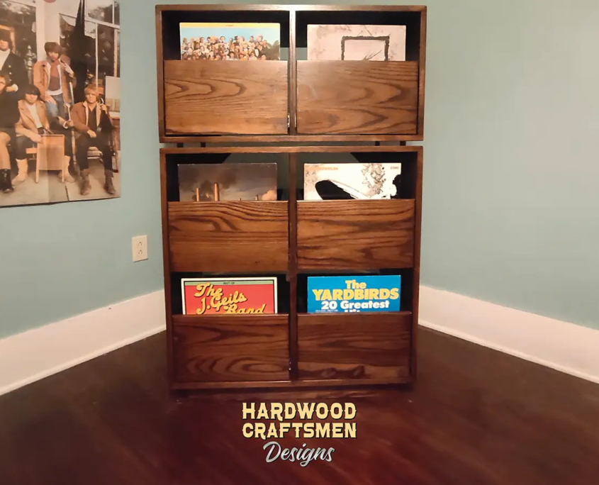 Dovetail 2 x 3 record player stand features 6 pull out vinyl storage drawers below a turntable and equipment shelf. This LP cabinet is available in solid walnut, ash, red oak, maple, cherry and oak, all on a 3 inch 100% hardwood plinth base.