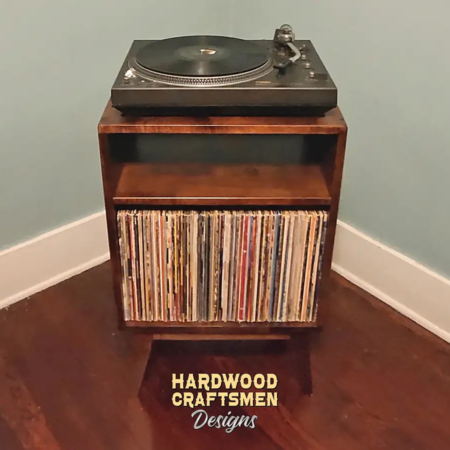 Record storage console in solid cherry features 1-to-4 lower bin storage below audio bays & turntable shelf. This media cabinet 2-tier is available from 20-to-48-inches, all on tapered mid-century legs.