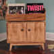 Solid maple record flip bins cabinet with doors features 2-to-4 vertical bins below 2-to-4 LP flip bin compartments, This vinyl stand 4-tier is available from 42-to-70-inches, all on tapered mid-century legs.