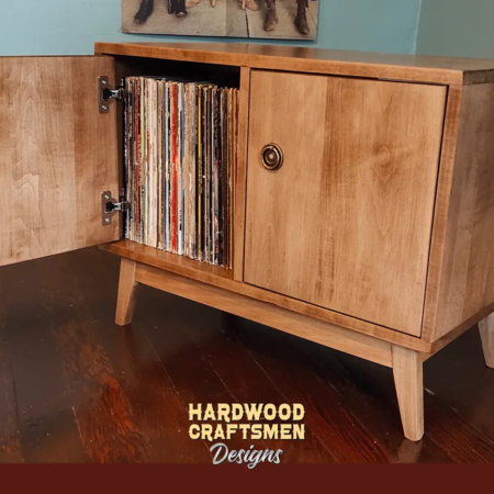 Low profile solid maple 1 x 2 vinyl record storage featuring an upper turntable and media equipment shelf. The lower section includes a media cabinet with two hardwood doors and two divided storage compartments.