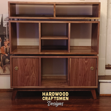 Solid walnut stereo cabinet with vinyl record storage with 6 bins, 2 doors and 2 media bays.