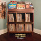 Solid walnut record storage cabinet featuring 9-to-15 LP flip bin compartments, available from 42-to-70-inches. This vinyl stand 5-tier features upper forward facing bins above 6-to-10 divided compartments, all on tapered mid-century legs.