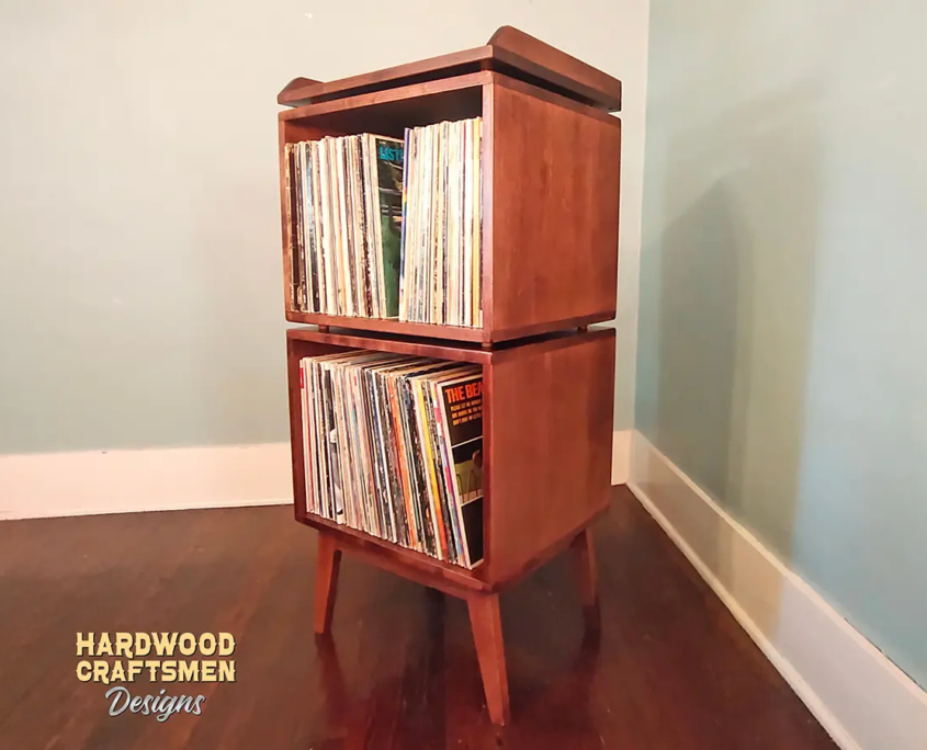 Custom solid cherry record player cabinet with vertical vinyl storage. Turntable stand and media console built to last.