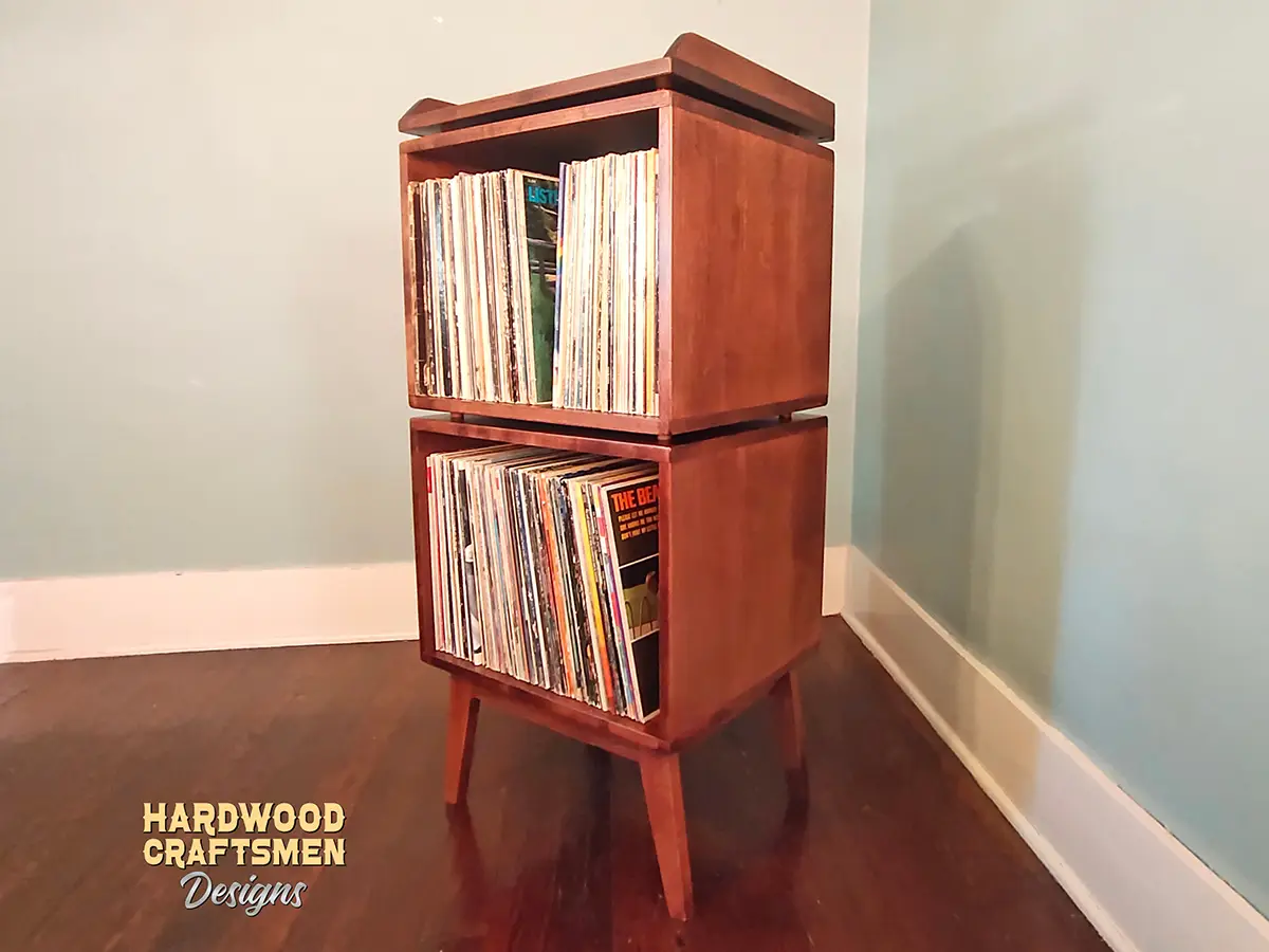 Custom solid cherry record player cabinet with vertical vinyl storage. Turntable stand and media console built to last.