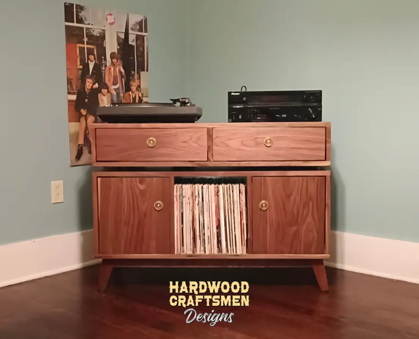 Record player stand 2-door with dovetail drawers 3 x 1.5 layout with 3 vinyl bin compartments, available from 42 to 72 inches. This media console in solid walnut cabinet features an upper TV shelf above three divided compartments, all on tapered mid-century legs.