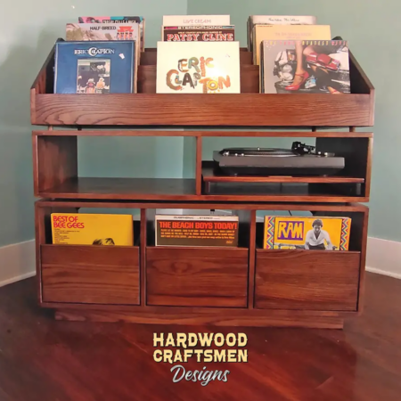 Dovetail 3 x 3 vinyl record shelves with equipment bays, 3 pull out storage drawers and 9 flip bins. This LP cabinet is available in solid walnut, ash, red oak, maple, cherry and oak, all on a 3 inch 100% hardwood plinth base.