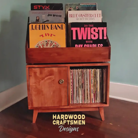 Solid cherry record storage cabinet with doors, features 2-to-4 bins below 6-to-12 LP flip bin compartments. This vinyl stand 4-tier is available from 28-to-56-inches, all on tapered mid-century legs.