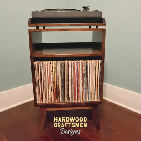 Low-profile solid cherry record console with a turntable and media shelf, 1 vinyl storage bin, and tapered mid-century legs.