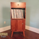 tall narrow vinyl record storage cabinet, solid wood record player stand, 1-drawer, 1-door, with turntable shelf and 1 record flip bin.