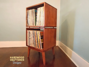 Record player cabinet vinyl storage with 2 bins built with solid maple wood, featuring a turntable shelf, two stacked storage compartments, and tapered mid-century legs.