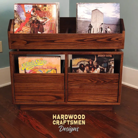 Dovetail 2 x 2 vinyl record storage features 2 pull out drawers below 2 flip bins. This LP cabinet is available in solid walnut, ash, red oak, maple, cherry and oak, all on a 3 inch 100% hardwood plinth base.