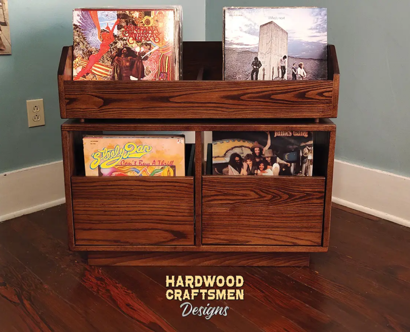 Dovetail 2 x 2 vinyl record storage features 2 pull out drawers below 2 flip bins. This LP cabinet is available in solid walnut, ash, red oak, maple, cherry and oak, all on a 3 inch 100% hardwood plinth base.