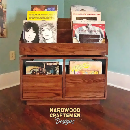 Dovetail 2 x 2 vinyl storage cabinet features 2 pull out drawers below 6 flip bins. This record stand is available in solid walnut, ash, red oak, maple, cherry and oak, all on a 3 inch 100% hardwood plinth base.