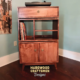 Vinyl record storage cabinet with dovetail drawers 3-tier layout with 3 vinyl bin compartments, available from 42 to 72 inches. This Media stand 2-door in solid maple features an upper audio shelves above four divided compartments, all on tapered mid-century legs.
