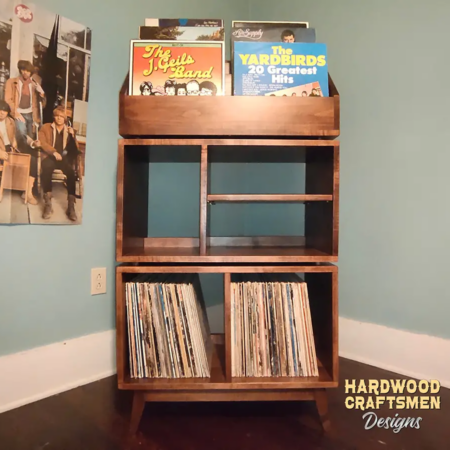 Solid maple record storage cabinet with 4 bins & 6-to-12 LP flip bin compartments, available from 28-to-56-inches. This vinyl stand 5-tier features upper forward facing bins above 4-to-8 divided compartments, all on tapered mid-century legs.