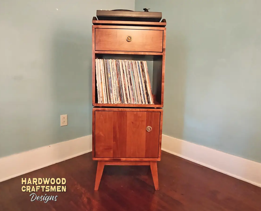 Solid cherry record player stand with dovetail drawers featuring 2-to-6 lower bins below turntable shelf. This media stand 3-tier is available from 20-to-48-inches, all on tapered mid-century legs.