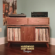 Vinyl storage cabinet with dovetail drawers 3 x 1.5 with 3 vinyl bin compartments, available from 42 to 72 inches. This media console in solid walnut features an upper TV shelf above three divided compartments, all on tapered mid-century legs.