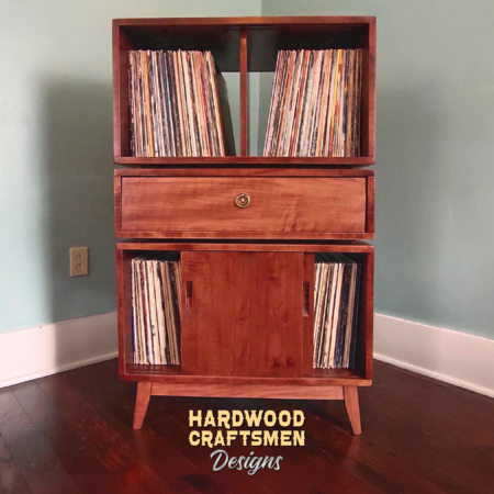 Solid cherry vinyl storage cabinet with drawers & sliding doors 2 x 3 layout with 3 vinyl bin compartments, available from 28 to 72 inches. This record player stand 4-bin features an upper audio shelves above four divided compartments, all on tapered mid-century legs.