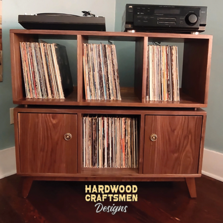 Solid walnut record storage console cabinet with 6 vinyl bins and turntable shelf on top.
