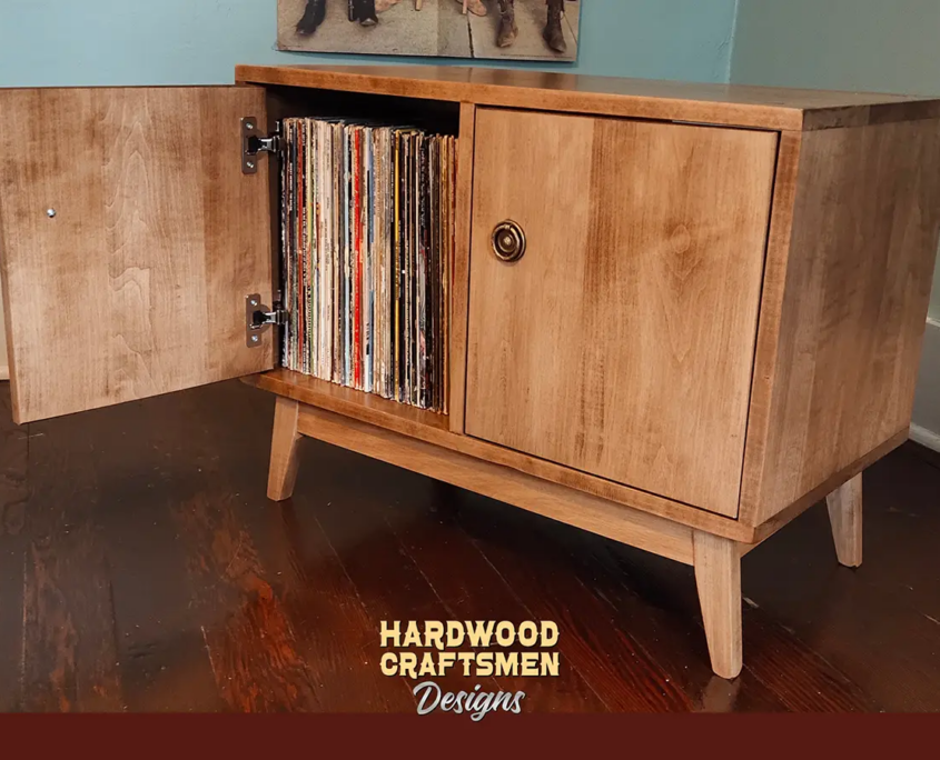 Low profile solid wood record cabinet featuring an upper turntable and media equipment shelf. The lower section includes a media cabinet with two doors and two divided storage compartments.