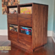 Dovetail 2 x 2 record storage cabinet features 4 pull out vinyl drawers below a turntable and equipment shelf. This LP player is available in solid walnut, ash, red oak, maple, cherry and oak, all on a 3 inch 100% hardwood plinth base.