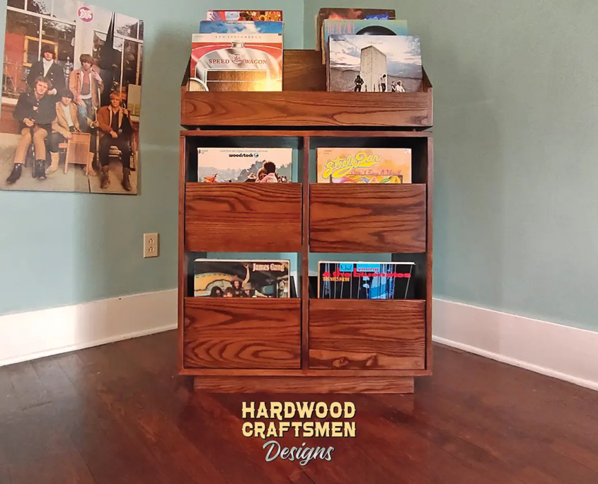 Dovetail 2 x 3 vinyl record storage features 4 pull out drawers below 6 flip bins. This LP cabinet is available in solid walnut, ash, red oak, maple, cherry and oak, all on a 3 inch 100% hardwood plinth base.
