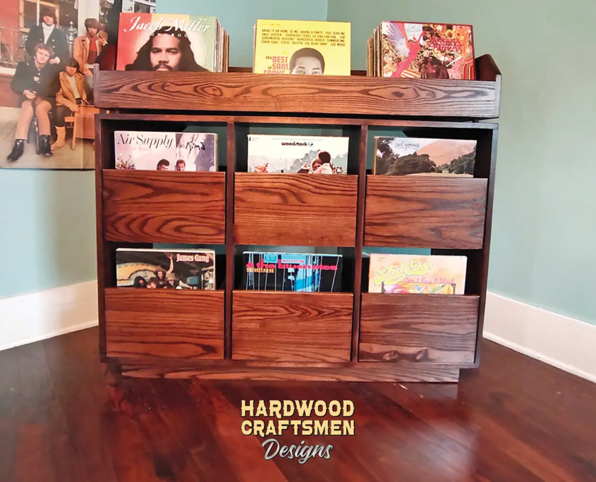 Dovetail 2 x 2.5 vinyl record stand features 6 pull out drawers below 3 flip bins. This LP cabinet is available in solid walnut, ash, red oak, maple, cherry and oak, all on a 3 inch 100% hardwood plinth base.