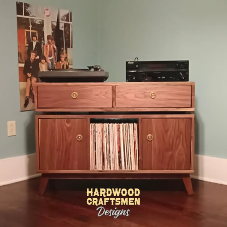 Solid walnut media console with dovetail drawers 3 x 1.5 layout with 3 vinyl bin compartments, available from 42 to 72 inches. This record player stand 2-door & console features an upper TV shelf above three divided compartments, all on tapered mid-century legs.