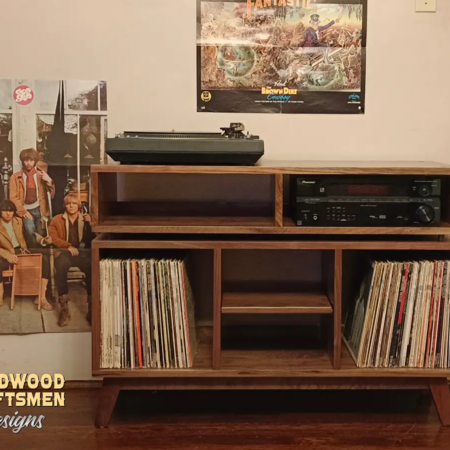 Solid wood media storage cabinet tv stand with 2 media bays and 3 vinyl bin compartments, available from 42 to 72 inches. This vinyl record storage & media cabinet features an upper TV shelf above three divided storage compartments, all on tapered mid-century legs.