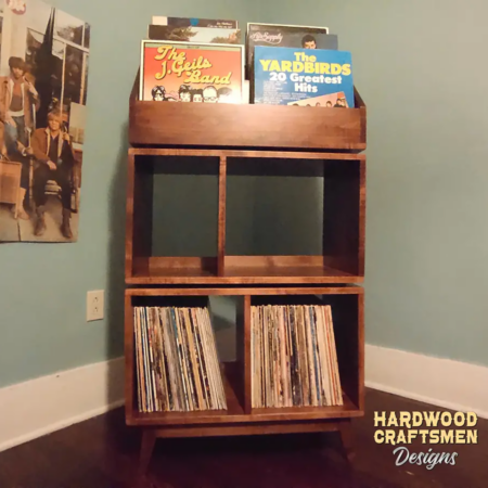 Record storage cabinet in solid maple features 4-to-8 storage compartments below 6-to-12 LP flip bins. This vinyl stand 5-tier is available from 28-to-56-inches, all on tapered mid-century legs.